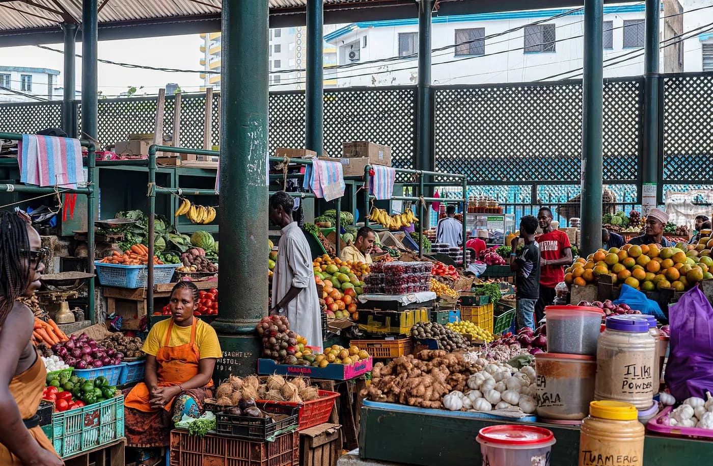 A narrow street in Mombasa's Old Town lined with market stalls